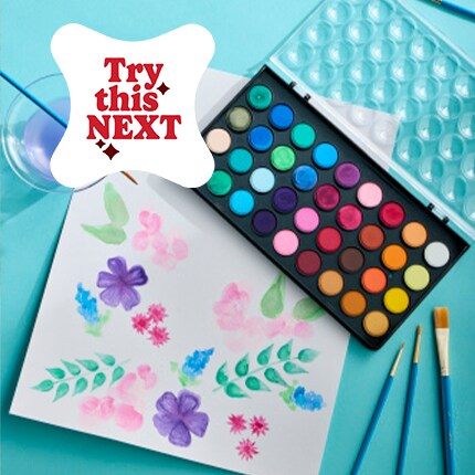 Watercolor Painting on a table with a paint set