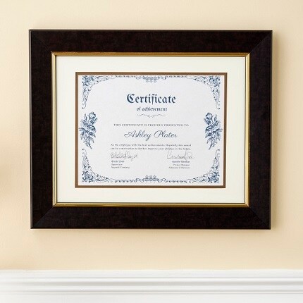 certificate in black frame on tan wall