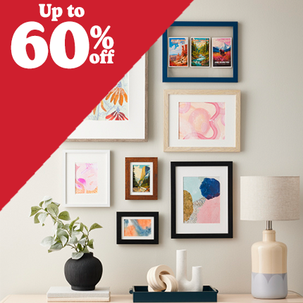 two brown wood and one white wood frames with white mats with 60% off in white text over red triangle