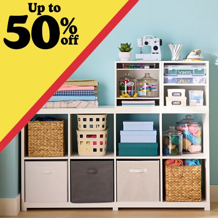 cube storage with yarn and sewing supplies with up to 50% off in black text over yellow triangle