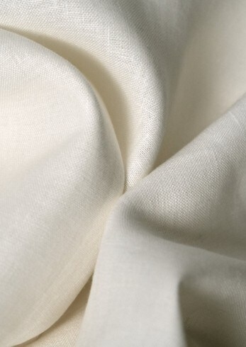 cream colored natural linen fabric close-up