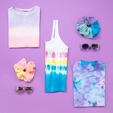 tees, tanks and accessories on purple background