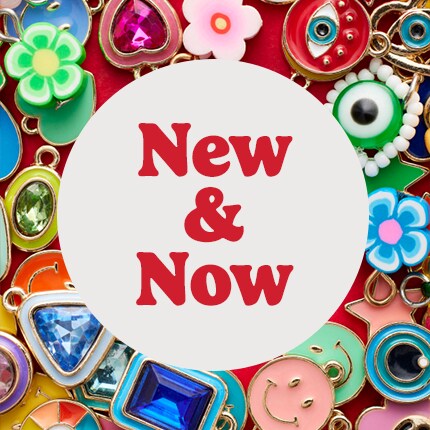 new & now in red text in white circle over charms