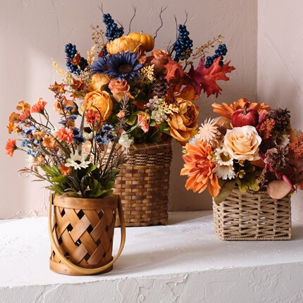 A group of flowers in baskets