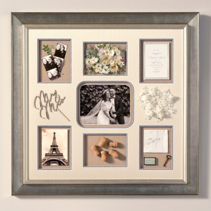 A frame with photos hung up on a wall