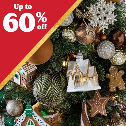 brown and green ball ornaments with gingerbread decorations on tree with up to 60% off in white text over red triangle