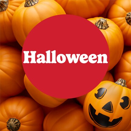 Halloween in white text in red circle over pumpkins and jack-o-lantern face