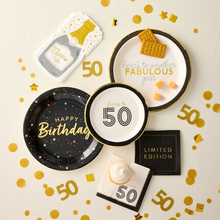 black white and gold 50th birthday tablescape for plates and confetti 