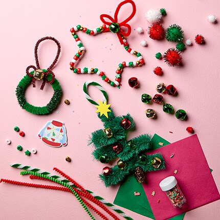 Christmas craft basics against a pink background. 