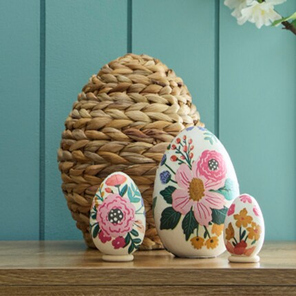 Decorative Easter Eggs on a table painted with flowers