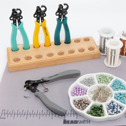 Beads supplies on gray mat