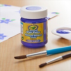 blue Crayola paint bottle on table