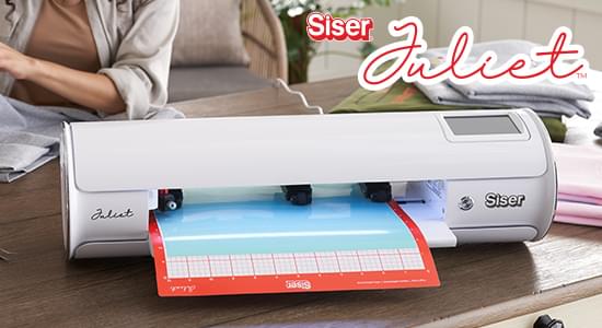 Cutting machine on table with notebook