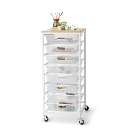 White Metro 8-Drawer Rolling Cart by Simply Tidy stocked with painting and art supplies