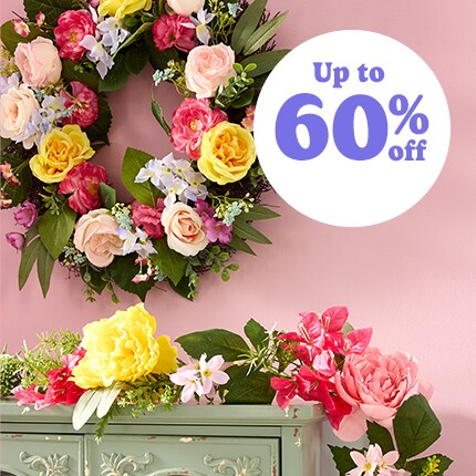 Easter wreath with floral and eggs and egg garland on a mantle 