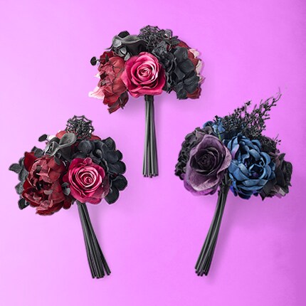 Three Floral bouquets with roses in dark red, dark blue and dark purple colors.