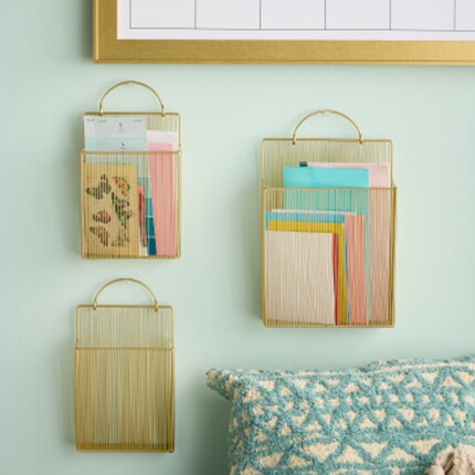 Organization baskets on a wall in cold mesh