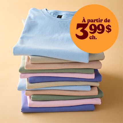 stack of brightly colored t-shirts in reverse rainbow order