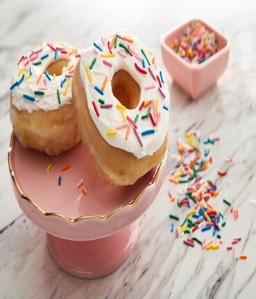 Pink stand with donuts & sprinkles